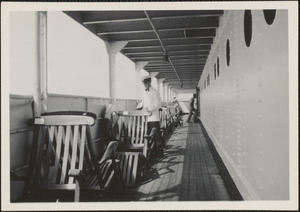 Steward arranging chairs after the big storm, S. S. American Trader