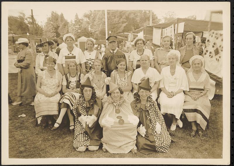 Costumed men and women at street fair