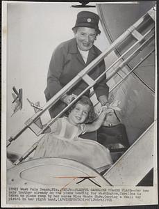 Playful Caroline boards plane