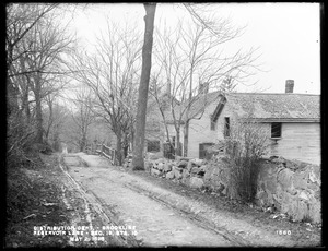 Distribution Department, Southern High Service Pipe Line, Section 19, Reservoir Lane, station 15+; William D. White's two houses and John J. Mooney's house, on the north side of lane, from the southeast, Brookline, Mass., May 2, 1898