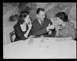 People smoking at table