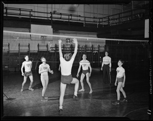 Youth playing volleyball