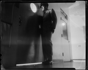 U.S.S. Bennington - board of inquiry. Military personnel looking through a door window