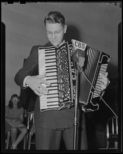 Boy playing accordion at CBS