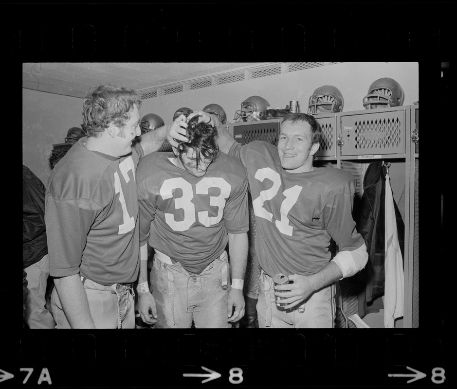 Boston College football players Frank Harris, Fred Willis, and George Gill celebrate after win against Holy Cross