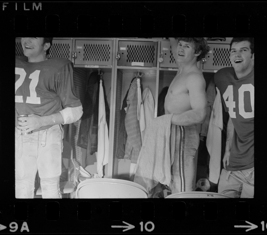 Boston College football player George Gill and two other unidentified players after a win against Holy Cross