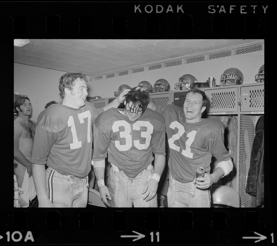 Boston College football players Frank Harris, Fred Willis, and George Gill celebrate after win against Holy Cross