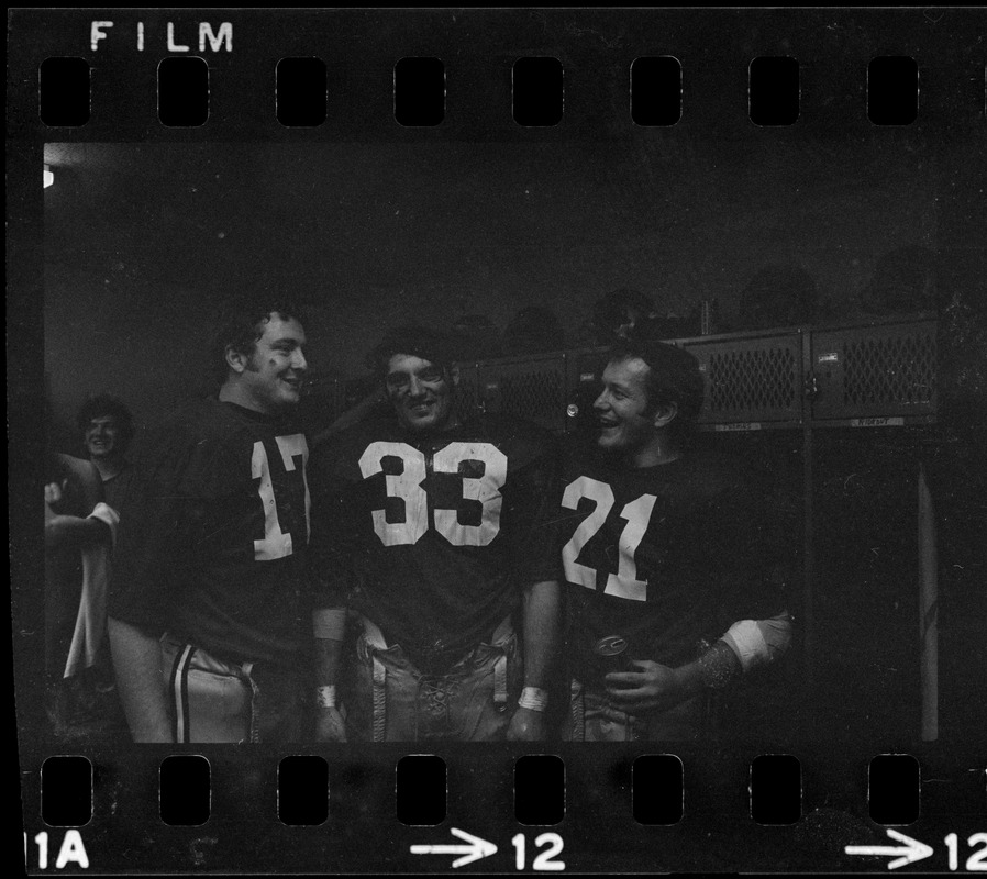 Boston College football players Frank Harris, Fred Willis, and George Gill celebrate after win against Holy Cross