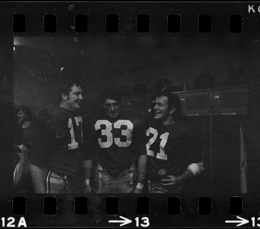 Boston College football players Frank Harris, Fred Willis, and George Gill celebrate after win against Holy Cross