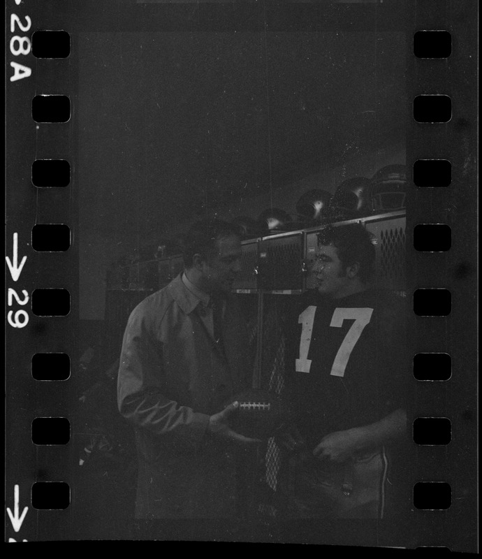 Boston College football coach Joe Yukica and quarterback Frank Harris in locker room after win against Holy Cross