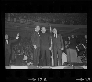 Mike Douglas, Richard Cardinal Cushing, and Stanley Blinstrub on stage at Blinstrub's Village benefit show, Boston Garden