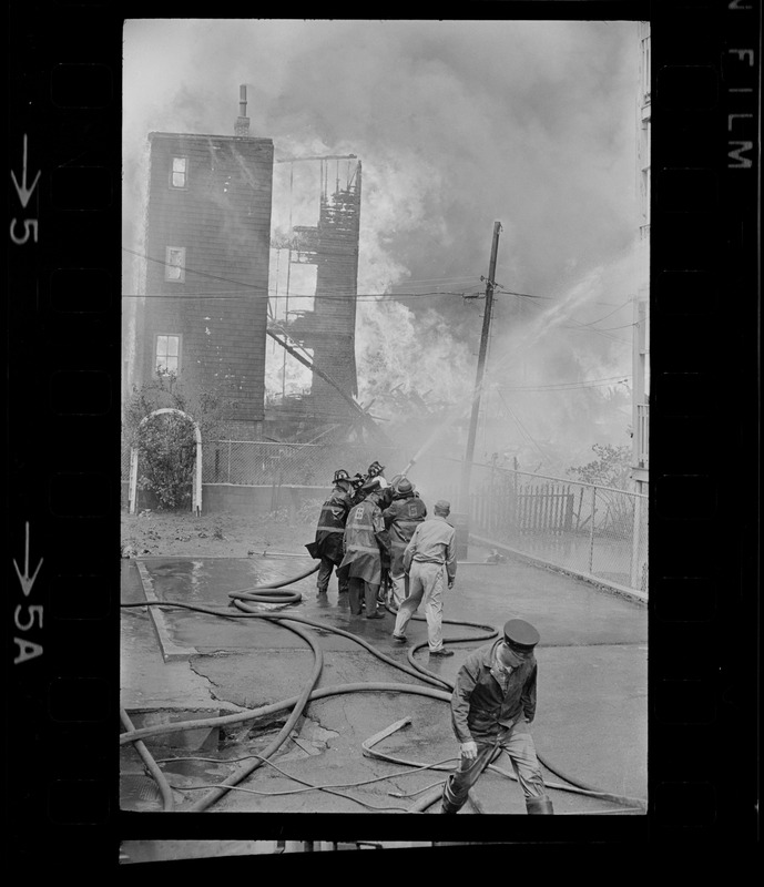 Firemen battling fire on Bellflower Street, Dorchester