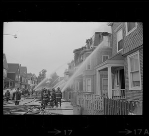 Firemen battling fire on Bellflower Street, Dorchester