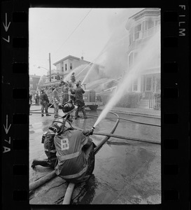 Firemen putting out fire with water pumps, Bellflower Street, Dorchester, MA