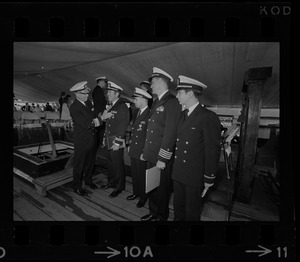 Rear Adm. Joseph Wylie presents medals to four Navy officers aboard his flagship, the U.S.S. Constitution. Receiving the decorations are, from left: Lt. Richard Pearsall, Lt. Cmdr. Ronald Scott, Capt. Karl Christoph, and Ens. Herbert Marks at medal ceremony on the U.S.S. Constitution