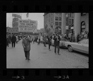 Demonstrators carrying signs - for and against Alabama Gov. George Wallace - gather outside Faneuil Hall where the presidential candidate was speaking