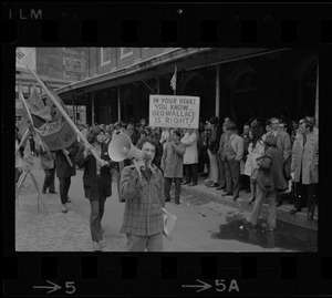 Demonstrators carrying signs - for and against Alabama Gov. George Wallace - gather outside Faneuil Hall where the presidential candidate was speaking