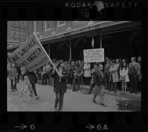 Demonstrators carrying signs - for and against Alabama Gov. George Wallace - gather outside Faneuil Hall where the presidential candidate was speaking