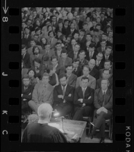 Unidentified speaker addressing an audience from a lectern