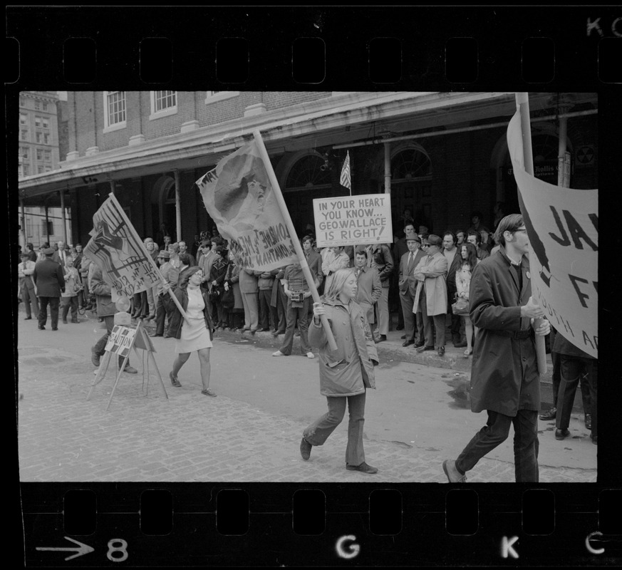 Demonstrators carrying signs - for and against Alabama Gov. George Wallace - gather outside Faneuil Hall where the presidential candidate was speaking