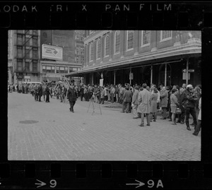 Demonstrators carrying signs - for and against Alabama Gov. George Wallace - gather outside Faneuil Hall where the presidential candidate was speaking