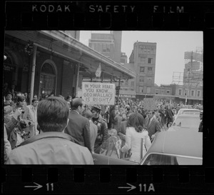 Demonstrators carrying signs - for and against Alabama Gov. George Wallace - gather outside Faneuil Hall where the presidential candidate was speaking