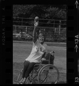 Bea Anderson, Olympic wheelchair champ from West Brookfield, in shot put event at Boston's "Happening for the Handicapped" on Boston Common