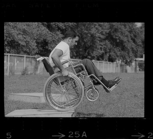 Unidentified man in wheelchair at Boston's "Happening for the Handicapped" on Boston Common