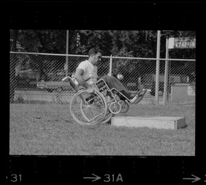 Unidentified man in wheelchair at Boston's "Happening for the Handicapped" on Boston Common