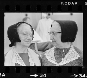 Two older women in bonnets at Winterfest