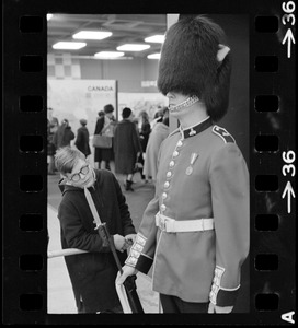 Boy inspects man in Grenadier Guard uniform at Winterfest