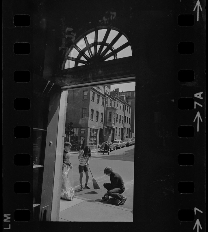 Cleaning up Charles Street day after anti-Hippie violence