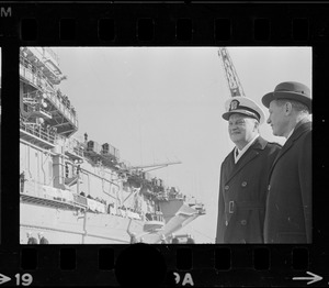 Governor John Volpe and Rear Adm. William B. Sieglaff watch the aircraft carrier Wasp arrive in port at South Boston after picking up Gemini astronauts