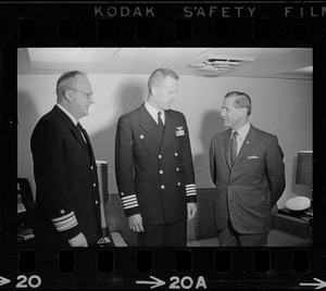 Rear Adm. William B. Sieglaff, possibly Capt. Gordon H. Hartley, and Governor John Volpe aboard the aircraft carrier Wasp in port at South Boston after picking up Gemini astronauts