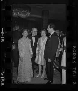 Iranian Princess Ashraf Pahlavi, two unidentified people, and Dr. Morris Abram at Brandeis University commencement banquet