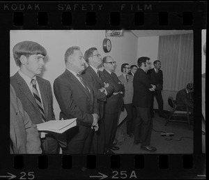 People, including Cambridge NASA Director James Elms, third from left, possibly during announcement of closure of Cambridge NASA Electronics Research Center