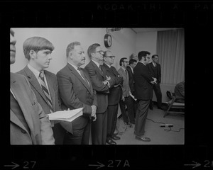 People, including Cambridge NASA Director James Elms, third from left, possibly during announcement of closure of Cambridge NASA Electronics Research Center