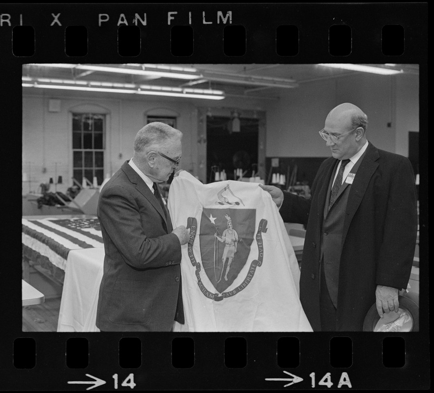 Men holding Massachusetts flag at Mass. Women's Correctional Institution, Framingham