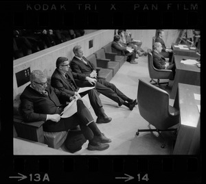 An unidentified man, John J. Craven, and Paul Tierney in Boston city council chamber for mayor's State of the City address