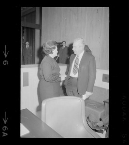 Louise Day Hicks talking to unidentified man in Boston City Council chamber