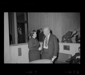 Louise Day Hicks talking to unidentified man in Boston City Council chamber