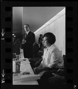 Mayoralty candidate Kevin White address students and newsmen while his opponent, Mrs. Louise Day Hicks, listens at a debate sponsored by the Sigma Delta Chi fraternity held in the executive dining room at the Prudential Center
