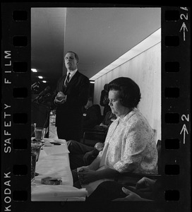 Mayoralty candidate Kevin White address students and newsmen while his opponent, Mrs. Louise Day Hicks, listens at a debate sponsored by the Sigma Delta Chi fraternity held in the executive dining room at the Prudential Center