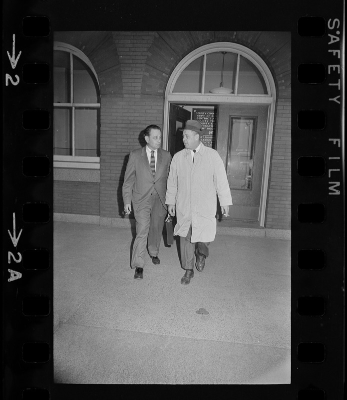 Atty. James M. Oates Jr. (left) of the school committee and Watertown town counsel Philip Grogan leave Middlesex Superior Court