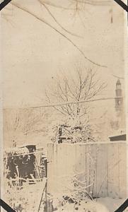 Snow scene with church steeple in background