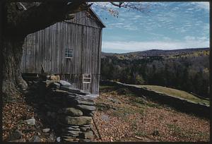Autumn scene of stone wall and barn
