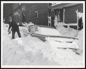 Mike Marino, Commercial St., North End - puts his back to shovel.