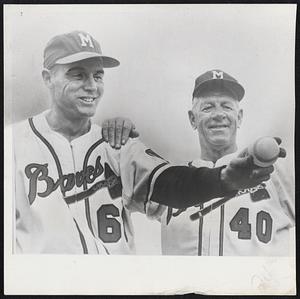 Gene Bearden (left) is shown with Manager Charley Grimm at Braves camp in Bradenton, Fla. The left-hander is trying a comeback to the majors after posting 20 victories last year with San Francisco. He knocked the Red Sox out of intra-city World Series in 1948 when he pitched the Indians to win over Red Sox after teams had ended season tied for first. Cleveland then defeated the Boston Braves in series.