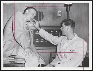 Checking on Hurricane Connie, via radio, are Bob Chakales, left, and Maury McDermott, Washington Senator pitchers. They're listening in on the Hotel Kenmore radio before heading for Fenway Park tonight for a game with the Red Sox.