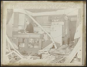 Oak Lawn, Ill: Mrs. Ruby Houston checks the cupboards in kitchen of her home here 4/22, which virtually destroyed when tornado swept through area late 4/21. Mrs. Houston's main lament was she had just cleared the house yesterday. Tornado caused many deaths and injuries, and property damage was extensive.